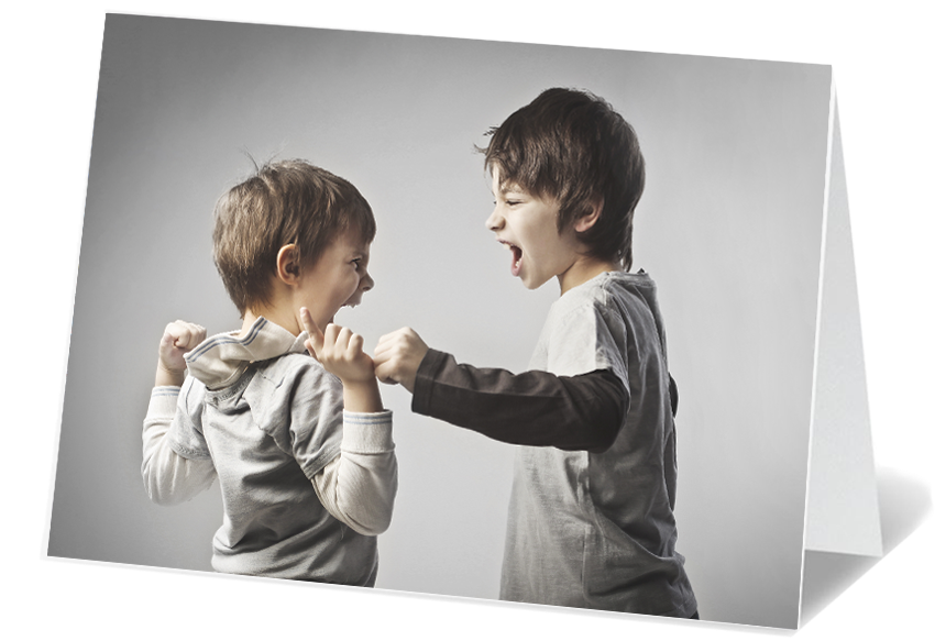 Two young boys are shown arguing and the boy on the right, who appears slightly older, is yelling with his mouth wide open, while the younger boy on the left is holding up his fists and appears to be responding in anger. They are facing each other with tense expressions.